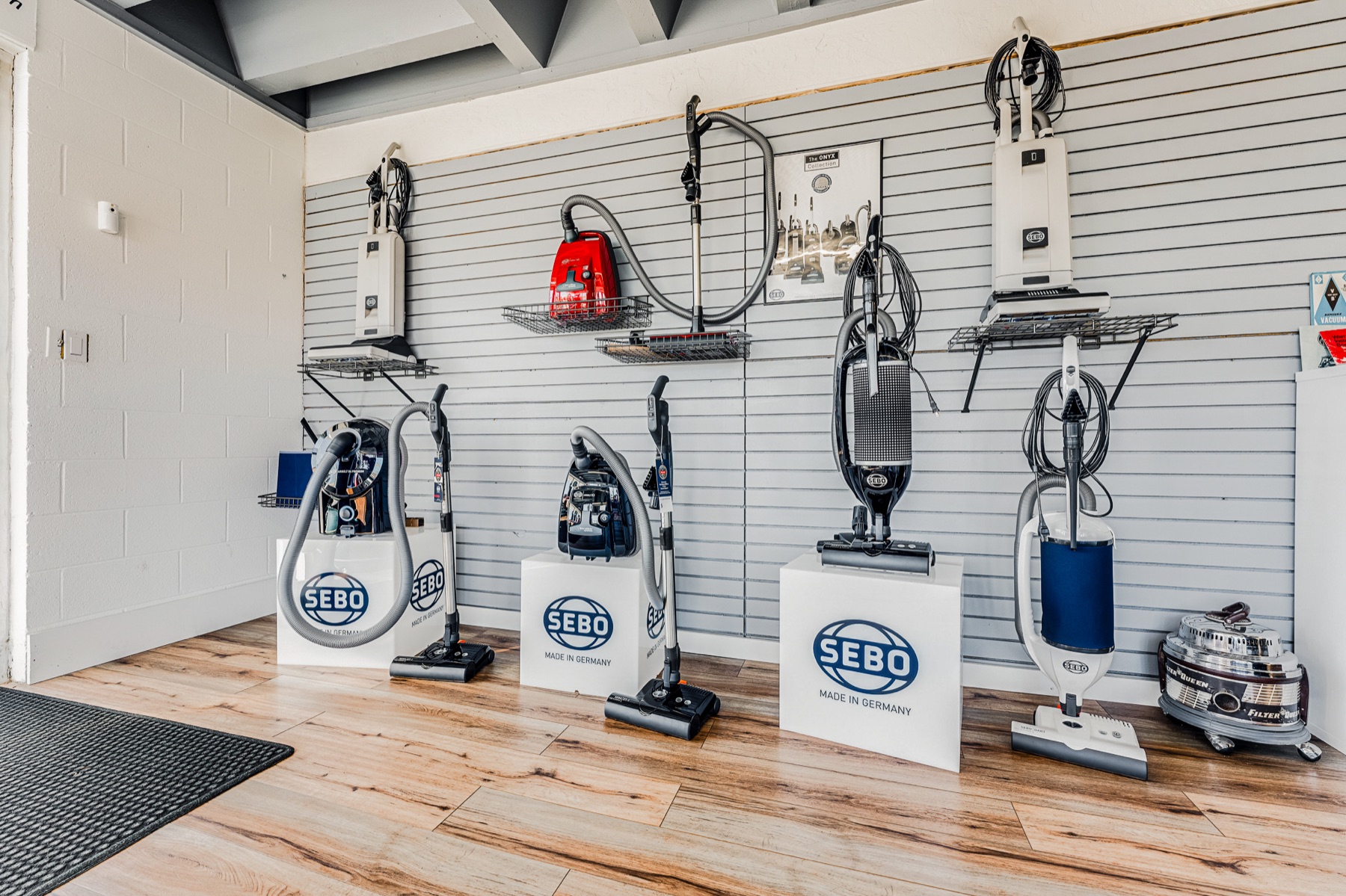 Sebo machines on the showroom wall