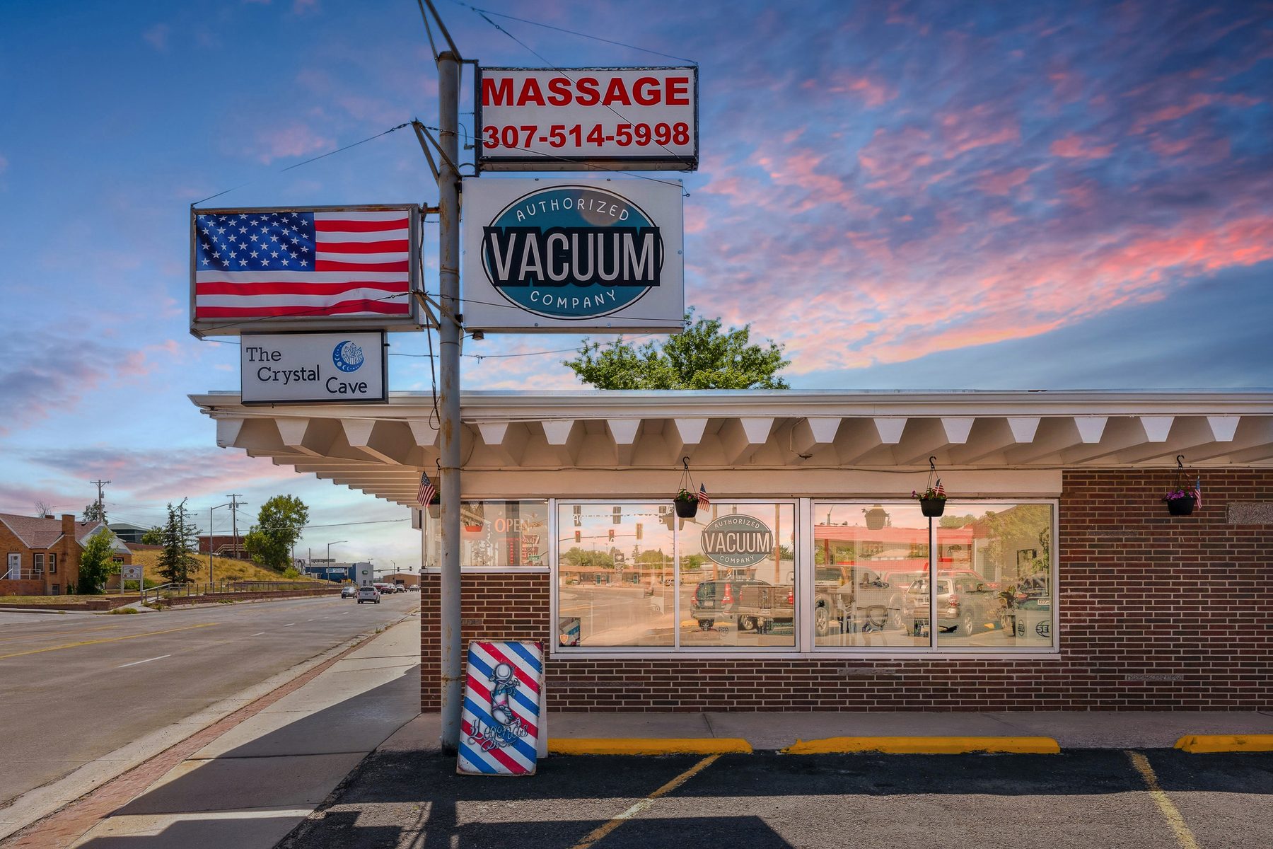 Authorized Vacuum Company pole sign with the American flag